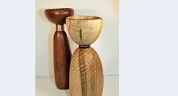 a wooden objects on a white surface