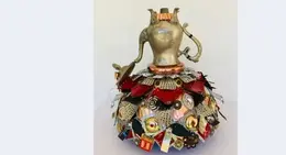 a decorative object with a metal object on top