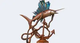 a statue of a fish and an anchor