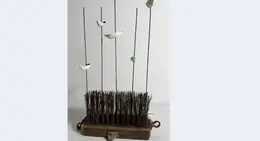 a sculpture of birds on sticks