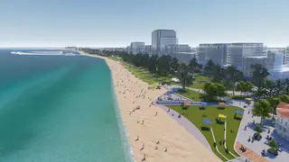 a beach with trees and buildings